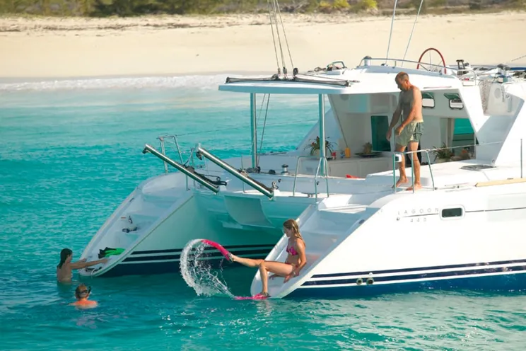 Bright, modern interior salon of the Lagoon 440 with panoramic Gulf views and a champagne lunch