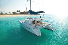 Guests boarding the Lagoon 440 catamaran at Fort Myers Beach marina with champagne waiting on the swim platform
